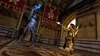 A scene from a video game showing two characters in combat within a large hall. Produktbild-Vorschau