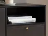 A close-up view of a black wooden sideboard with a drawer and an open shelf containing books. Podgląd zdjęcia produktu