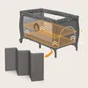 A baby crib with a diagram showing adjustable mattress height and a separate foldable mat. Podgląd zdjęcia produktu