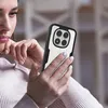 A woman is holding a smartphone with a protective case. Produktbild-Vorschau