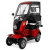 A red four-wheeled mobility scooter with a canopy and windshield, shown from the front-left on a white background. Produktbild-Vorschau