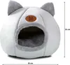 A light gray cat bed with gray ears and trim, featuring a brown logo with the letter 'M' and the brand name 'Mersja'. Dimensions are indicated by measurement lines and text. Podgląd zdjęcia produktu