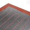 A close-up, angled view of a baking mat with a grid pattern and wavy lines. Podgląd zdjęcia produktu