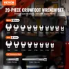 A marketing image showcasing a 20-piece crowfoot wrench set with metric and SAE sizes, along with extension bars. The background shows a blurred workshop environment with people. Náhled obrázku produktu