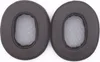 Two brown ear pads for headphones are shown against a white background. Podgląd zdjęcia produktu
