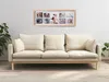 A beige sofa in a living room with a photo frame collage on the wall above it. Podgląd zdjęcia produktu