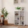 A white bookshelf with items on it, next to a large potted plant. Produktbild-Vorschau