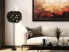 A living room scene with a floor lamp, sofa, and coffee table. Voir les images du produit