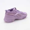 A side view of a purple Reebok sneaker. Náhled obrázku produktu