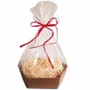 A gift basket filled with shredded paper, wrapped in clear cellophane and tied with a red ribbon. Produktbild-Vorschau
