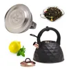 A collage of a black kettle, its lid, loose tea leaves, and a lemon with mint leaves. Produktbild-Vorschau