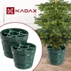 A Christmas tree stand is shown in a barrel-like design, with a logo and text overlay. Voir les images du produit