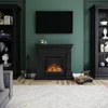 A living room scene featuring an electric fireplace, a television mounted above it, and two tall bookshelves on either side. Produktbild-Vorschau