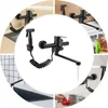 A collage of images showing a black kitchen faucet with a sprayer in various settings and close-ups, including washing produce and being installed. Náhled obrázku produktu