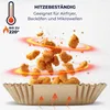 A paper liner for an air fryer filled with fried chicken pieces, with heat waves emanating from them. Anteprima dell’immagine prodotto