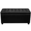 A black upholstered storage ottoman is shown against a white background. Podgląd zdjęcia produktu