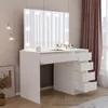 A white vanity table with a large mirror and LED lights, set in a room with curtains and a framed picture. Voir les images du produit