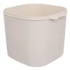 A single, empty, beige plastic container with a square base and rounded corners, viewed from a slightly elevated angle. Podgląd zdjęcia produktu