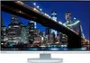 A monitor displaying a nighttime cityscape with a bridge. Produktbild-Vorschau