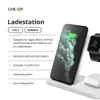 A white wireless charging station with a smartphone, smartwatch, and earbuds on it. Produktbild-Vorschau