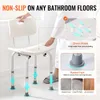 A person is demonstrating the features of a shower chair, with callouts highlighting its non-slip properties, drain holes, and rubber feet. Produktbild-Vorschau