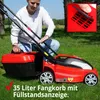 A person is demonstrating a red electric lawnmower on a grassy lawn. Produktbild-Vorschau