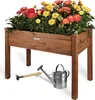 A wooden raised garden bed filled with red and yellow flowers, with a small rake and watering can placed in front of it. Produktbild-Vorschau