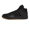 A black Adidas Hoops 3.0 Mid sneaker with a gum sole, shown from the side against a white background. Voir les images du produit