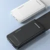Two power banks, one white and one black, are shown on a light gray background. Náhled obrázku produktu