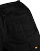 A close-up view of the back pocket area of black work pants. Anteprima dell’immagine prodotto