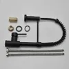 A collection of plumbing parts for a kitchen faucet, laid out on a white background. Produktbild-Vorschau