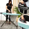 A woman is ironing clothes on a teal ironing board, with close-up shots of the iron and ironing board. Produktbild-Vorschau