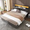 A bedroom scene featuring a modern upholstered bed with integrated storage and lighting. Podgląd zdjęcia produktu