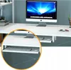 A close-up view of a white computer desk with a keyboard and mouse on a pull-out shelf, and a computer monitor on the main surface. Produktbild-Vorschau