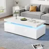 A modern living room scene featuring a white coffee table with LED lighting, a gray sofa, and decorative items. Voir les images du produit