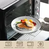 A plate of food is being placed into an oven. Náhled obrázku produktu