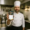 A chef in a kitchen holding up a smartphone displaying an air fryer cookbook. Náhľad obrázku produktu