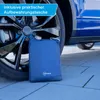 A blue car tire and a folded blue storage bag for a car cover. Anteprima dell’immagine prodotto