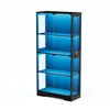 A four-tier glass display cabinet with blue interior lighting. Náhled obrázku produktu