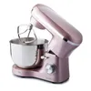 A rose gold stand mixer with a silver bowl and attachments, photographed against a white background. Podgląd zdjęcia produktu