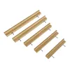 Five wooden drawer pulls of decreasing size are arranged diagonally on a white background, each with two screws showing. Produktbild-Vorschau