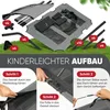 An image showing the assembly steps for a dog bed with a roof, with parts laid out on grass. Produktbild-Vorschau