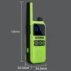 A green and black walkie-talkie with dimensions indicated. Voir les images du produit