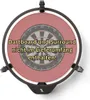 A dartboard with a red surround, mounted on a black base with a logo. Voir les images du produit