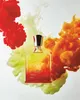 A bottle of Creed Original Santal perfume is displayed with colorful smoke clouds behind it. Anteprima dell’immagine prodotto