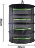 A black mesh drying rack with green zippers, shown hanging against a white background. Dimensions are indicated by text overlays. Produktbild-Vorschau