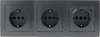 A close-up, front-facing view of a three-gang electrical outlet unit with two standard sockets and one socket with integrated USB-A and USB-C ports. Produktbild-Vorschau
