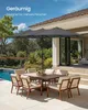 An outdoor patio scene with a dining set and a large double umbrella. Produktbild-Vorschau