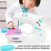 A young child wearing a lab coat is using a toy sewing machine. Produktbild-Vorschau