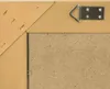 The back of a framed mirror, showing the hanging hardware and the backing board. Náhled obrázku produktu